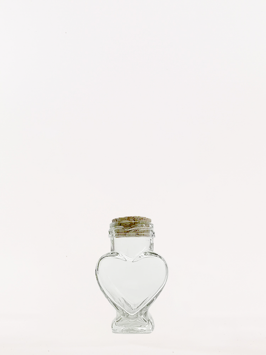 Heart shaped glass jar with corks
