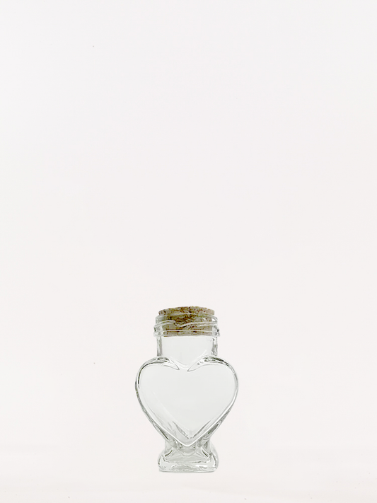 Heart shaped glass jar with corks
